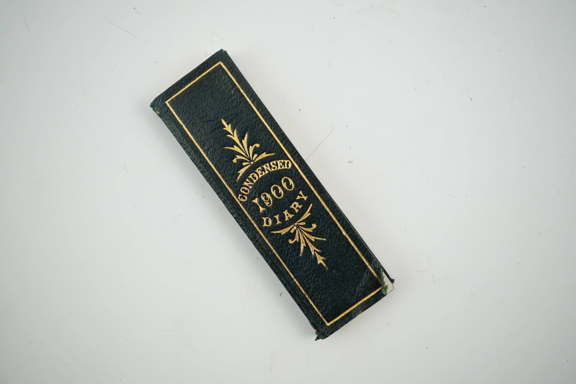 A De La Rue's Condensed Diary for 1900, unused, in original gilt morocco sheath, 8cm high. Condition - good